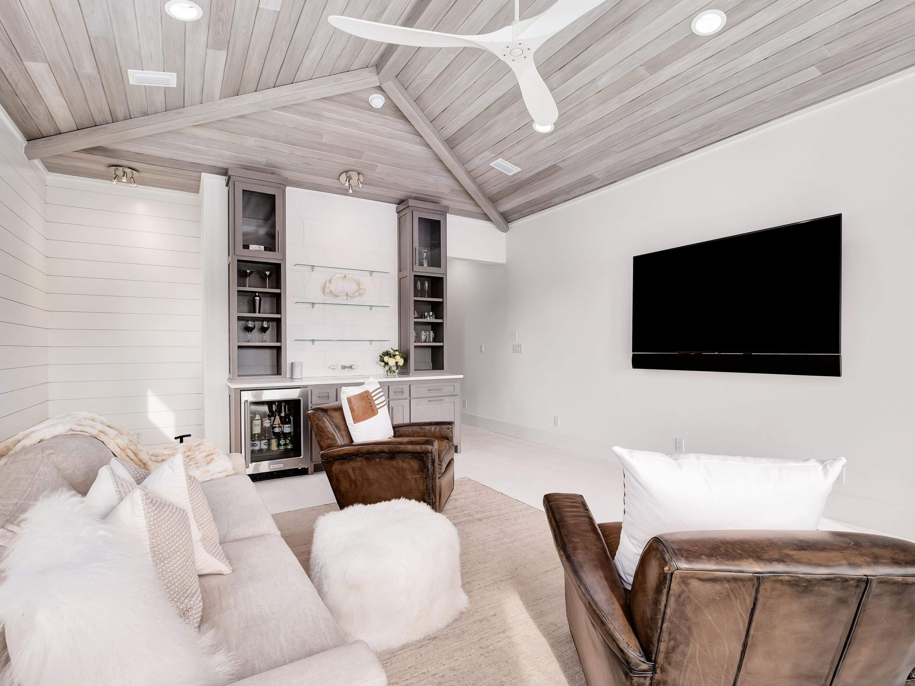 336 East Shipwreck Road Santa Rosa Beach, FL 32459 - Photo 20 of 54 a living room with furniture and a flat screen tv