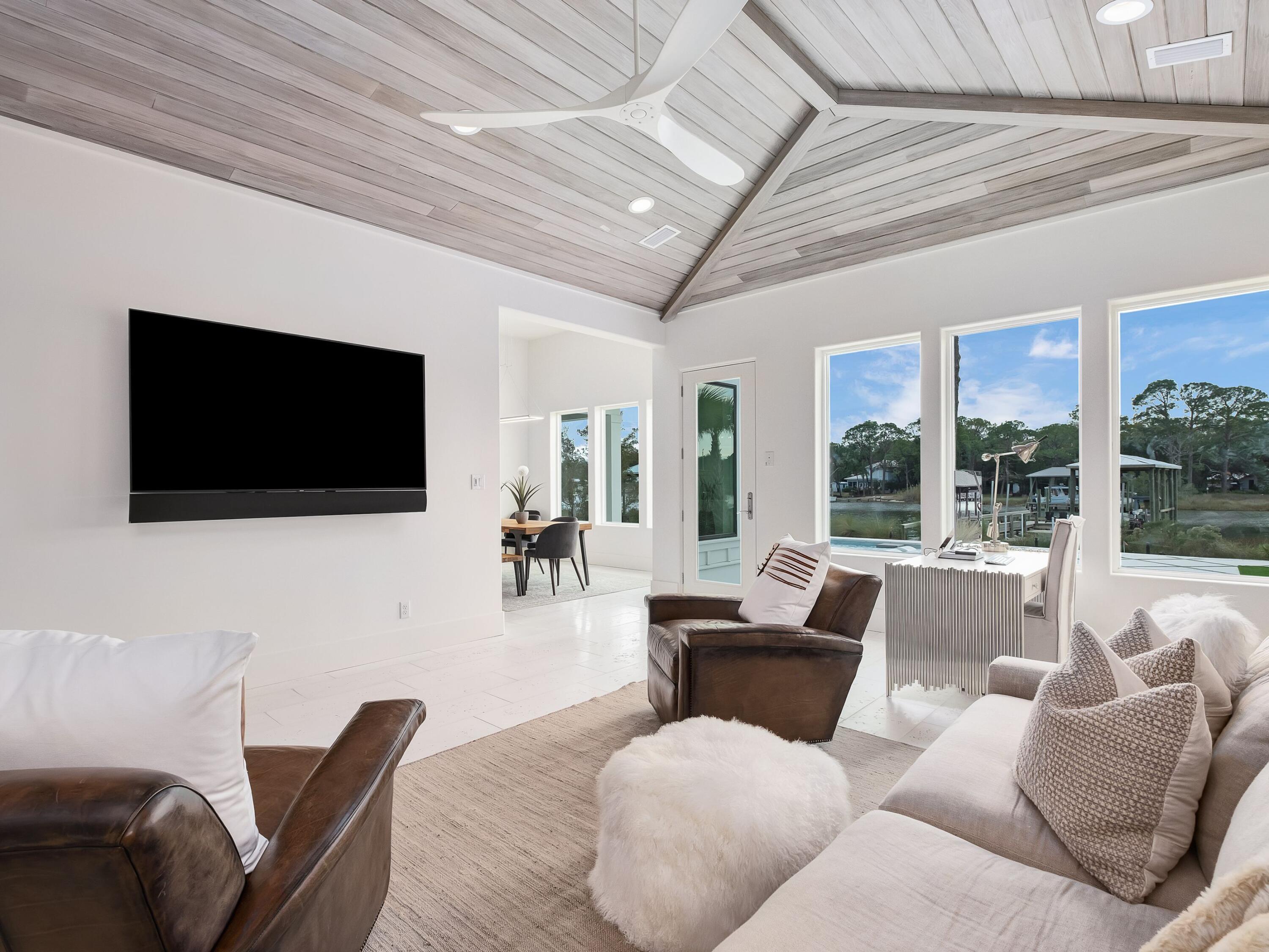336 East Shipwreck Road Santa Rosa Beach, FL 32459 - Photo 21 of 54 a living room with furniture and a flat screen tv