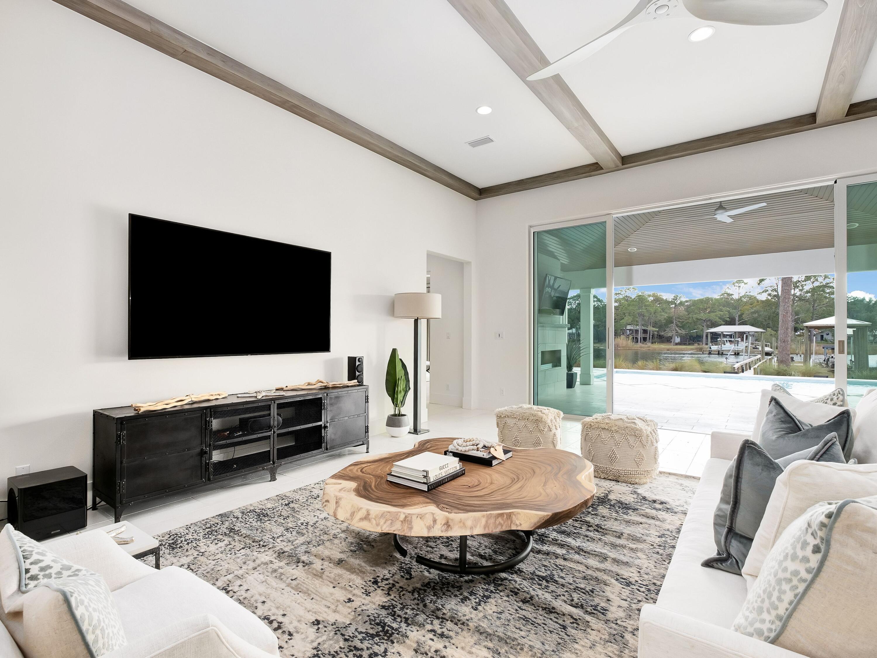 336 East Shipwreck Road Santa Rosa Beach, FL 32459 - Photo 23 of 54 a living room with furniture and a flat screen tv