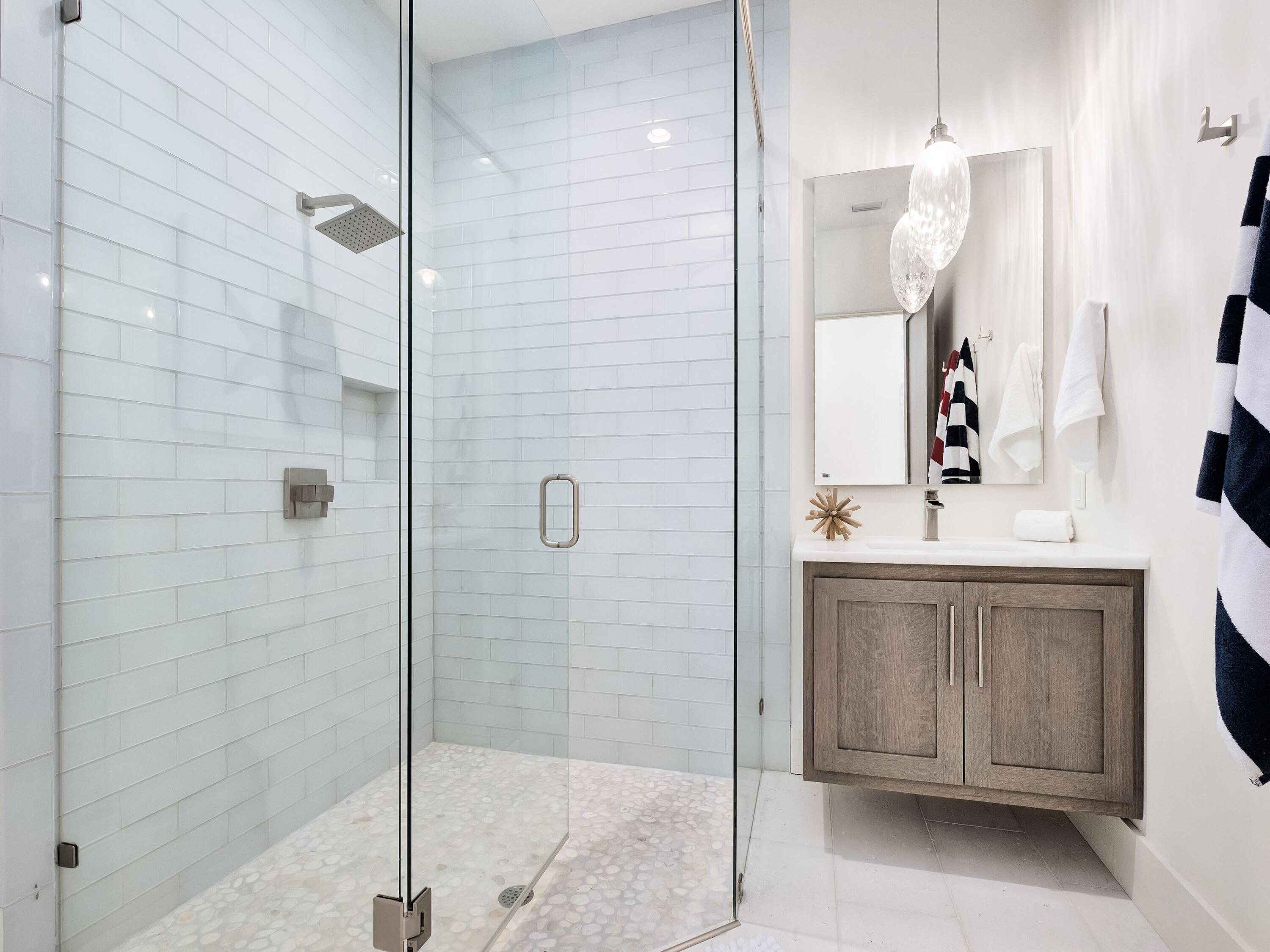 336 East Shipwreck Road Santa Rosa Beach, FL 32459 - Photo 32 of 54 a bathroom with a shower sink and mirror