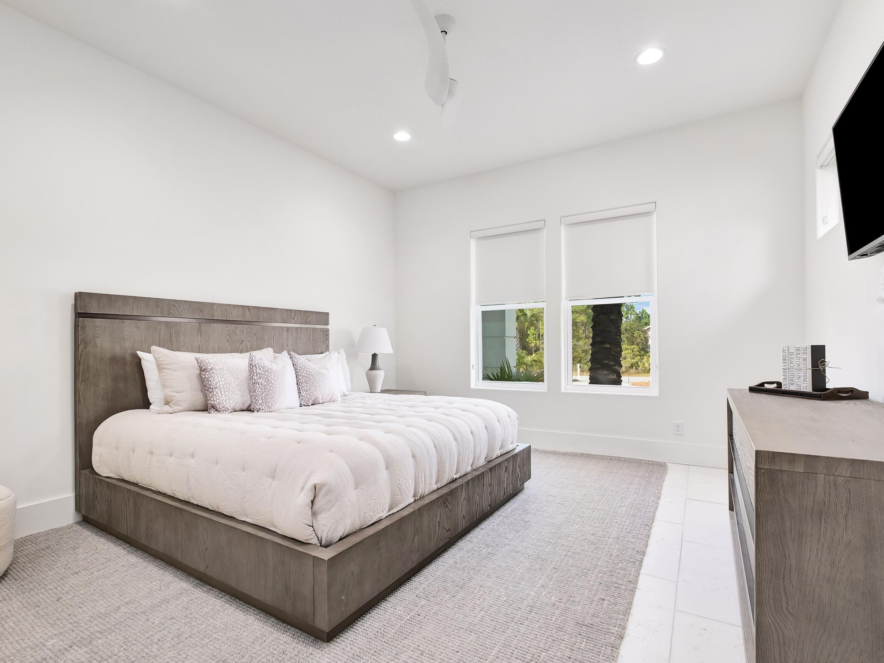 336 East Shipwreck Road Santa Rosa Beach, FL 32459 - Photo 33 of 54 a bedroom with a large bed and a flat screen tv