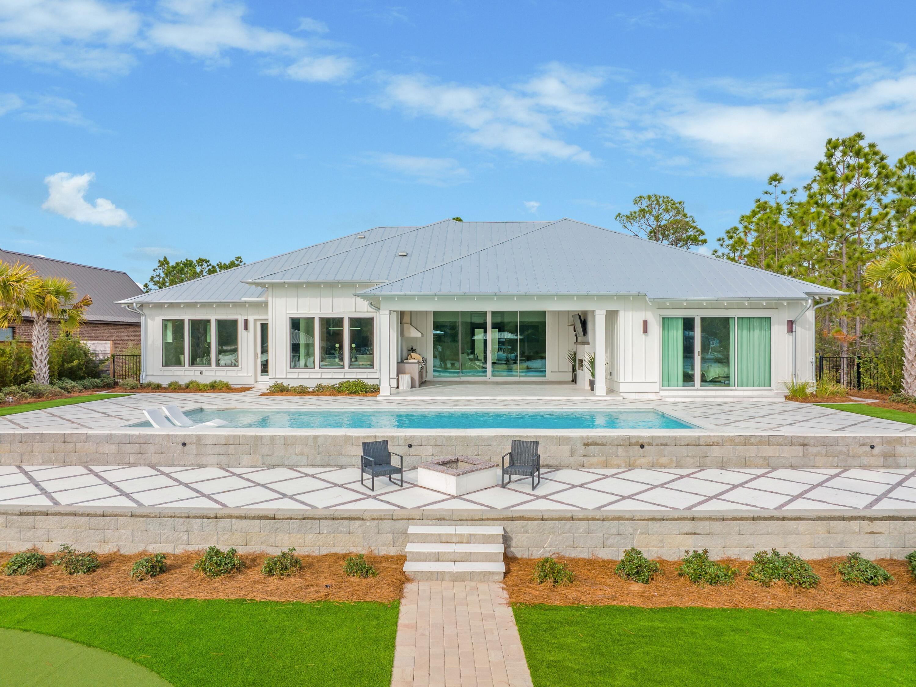 336 East Shipwreck Road Santa Rosa Beach, FL 32459 - Photo 45 of 54 a front view of a house with garden