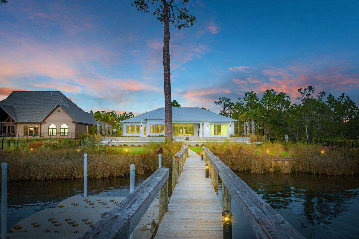 336 East Shipwreck Road Santa Rosa Beach, FL 32459 - Photo 48 of 54 a view of a house with swimming pool next to a yard