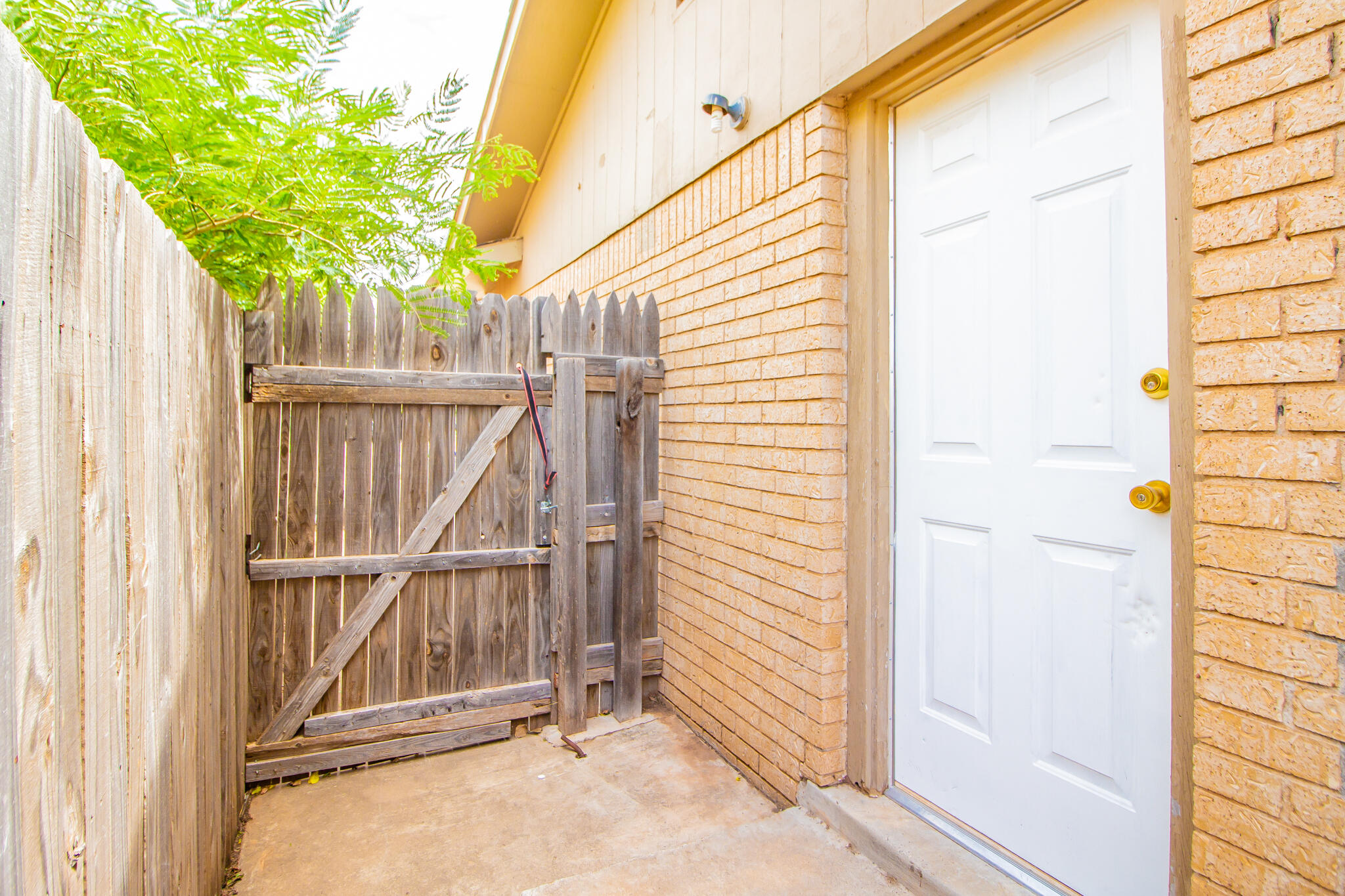 105 J B Avenue Floydada, TX 79235 - Photo 17 of 20 a view of a house with a wooden deck
