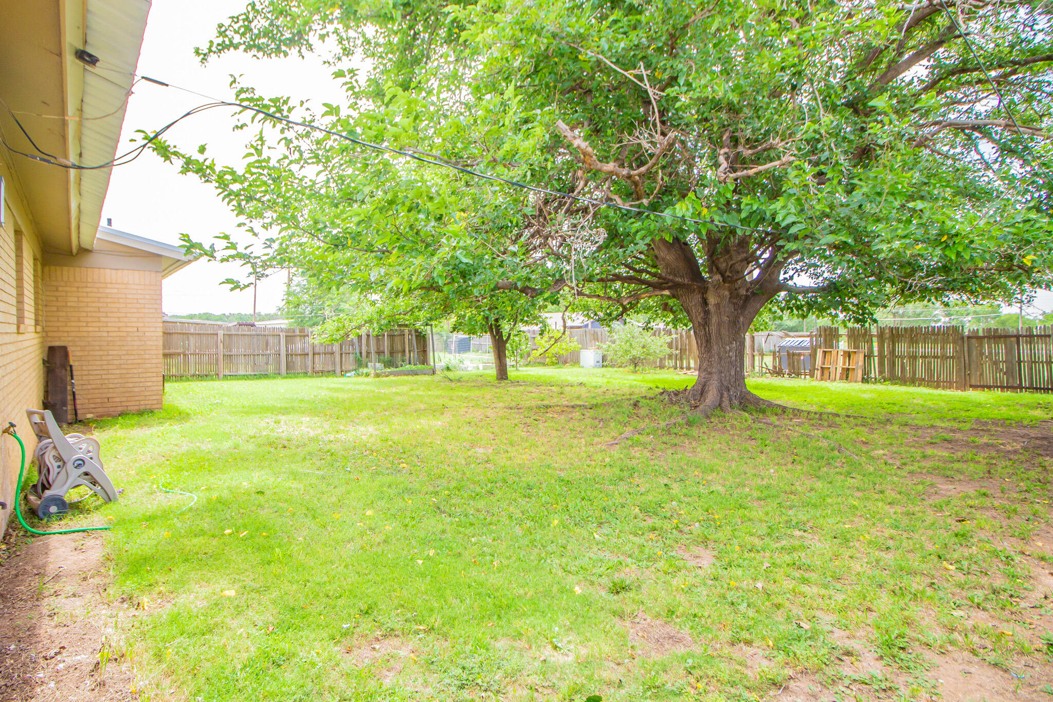 105 J B Avenue Floydada, TX 79235 - Photo 18 of 20 a house view with a garden space