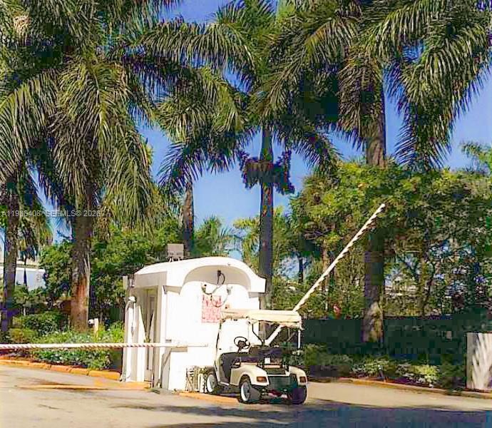 484 Northwest 165th St Road, Unit A412 Miami, FL 33169 - Photo 21 of 22 a car parked on the side of a road