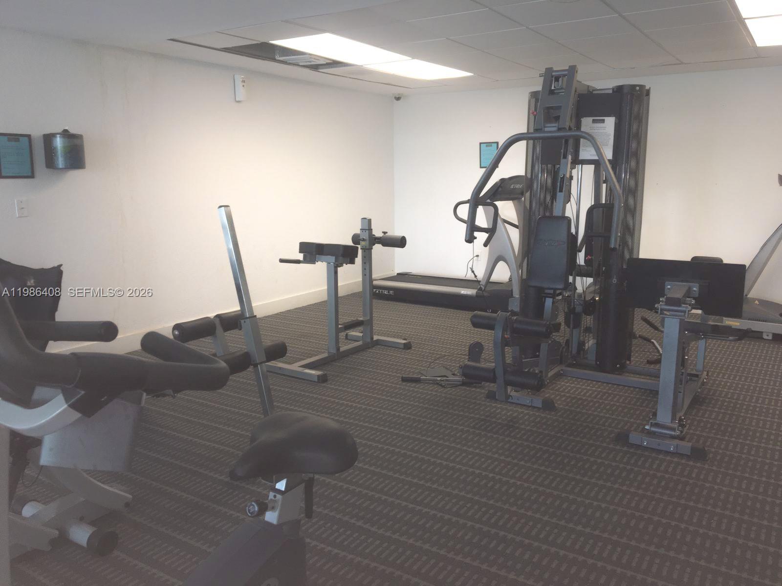484 Northwest 165th St Road, Unit A412 Miami, FL 33169 - Photo 22 of 22 a view of a room with gym equipment