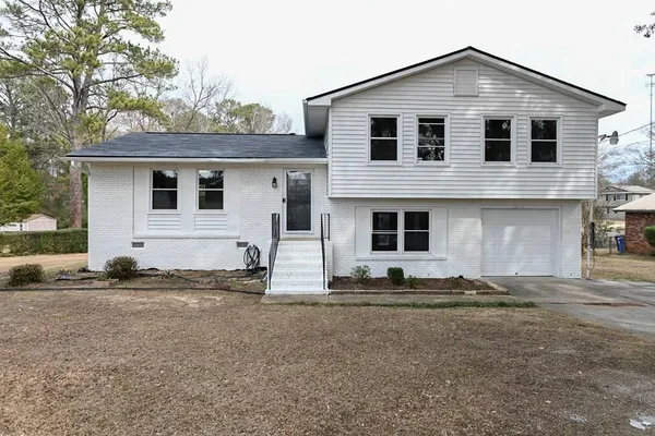 a front view of a house with a yard