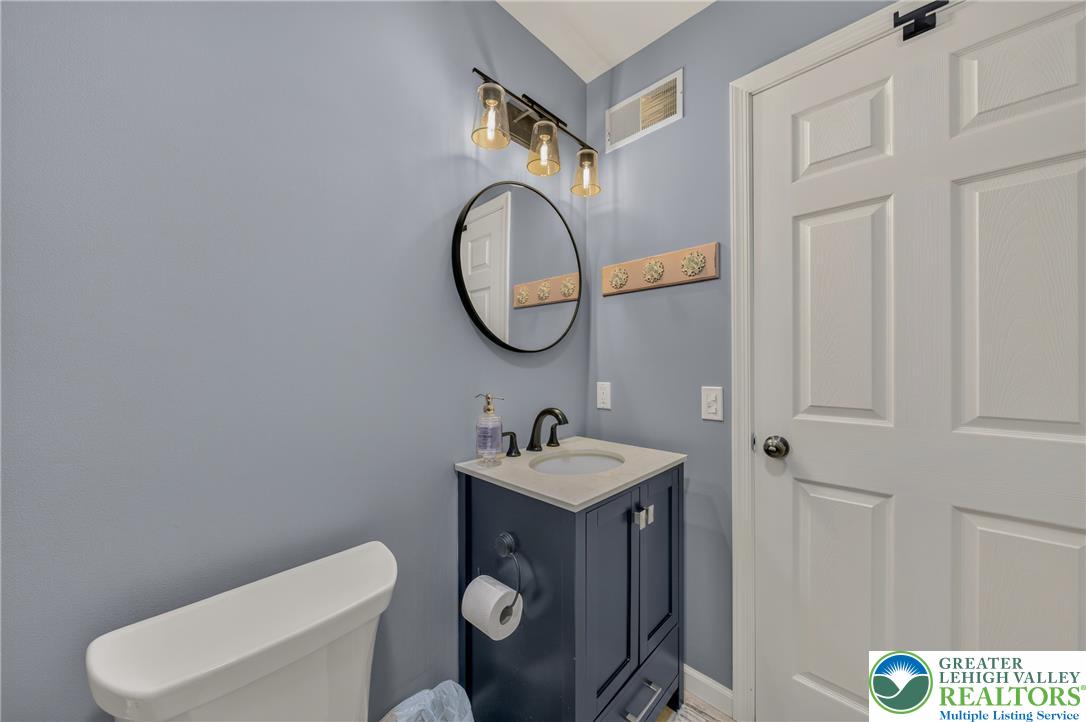 4236 Creek Road Allentown, PA 18104 - Photo 28 of 47 Modern vanity cabinetry and solid stone counters elevate this efficiently designed powder room.