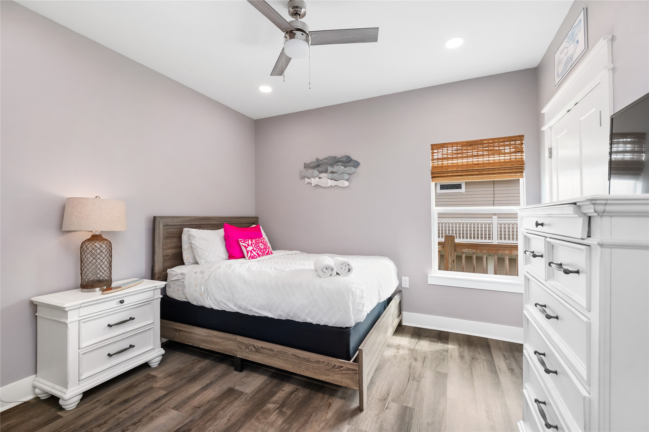 976 Albatros Crystal Beach, TX 77650 - Photo 12 of 30 a bedroom with a bed and a window