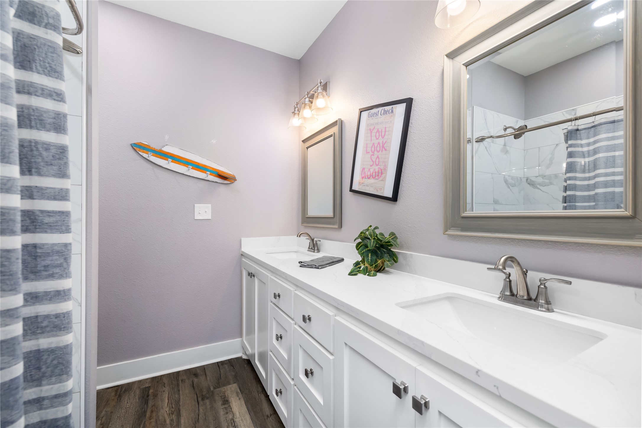 976 Albatros Crystal Beach, TX 77650 - Photo 18 of 30 a bathroom with a sink and a mirror