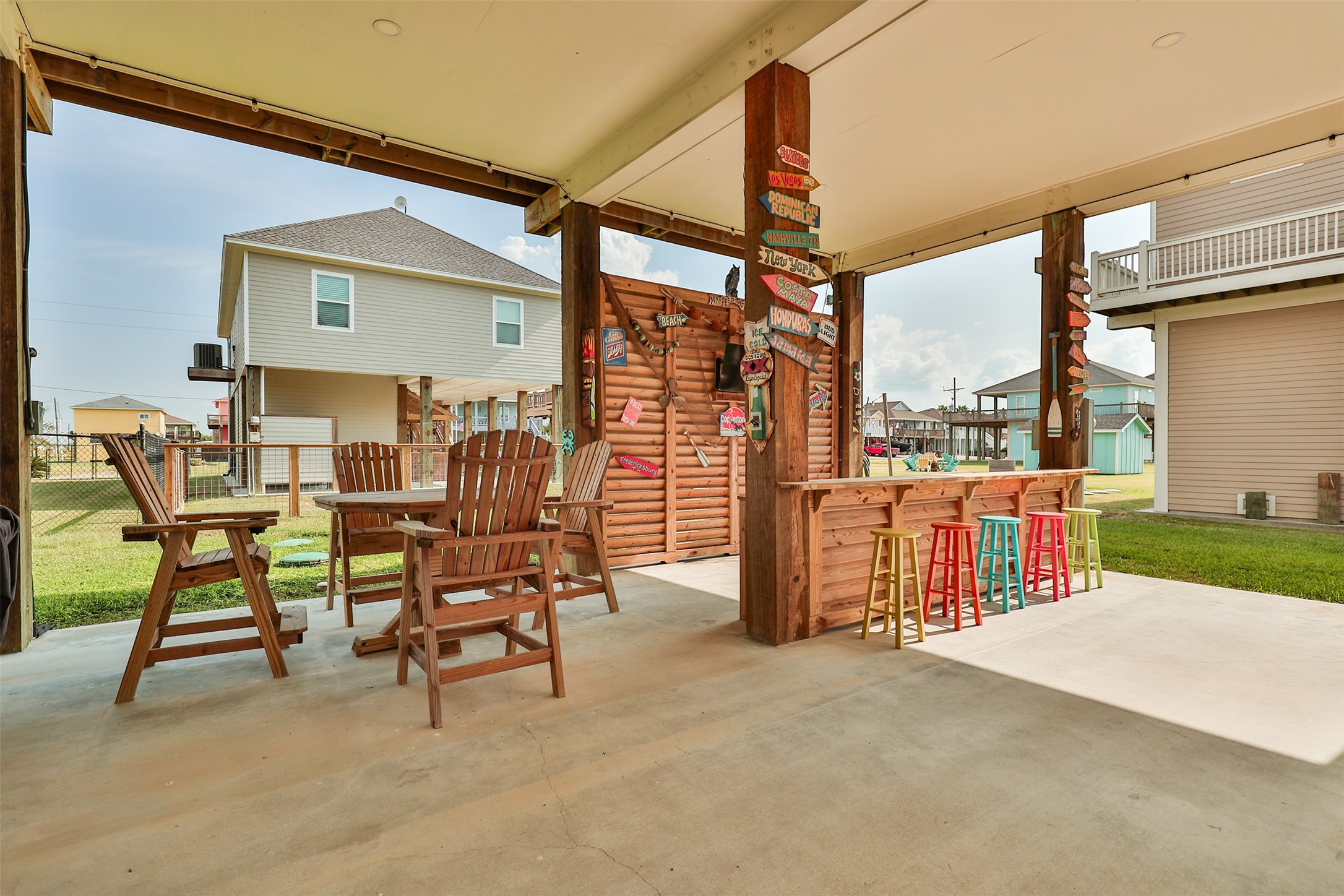 976 Albatros Crystal Beach, TX 77650 - Photo 25 of 30 a view of a patio with a table and chairs