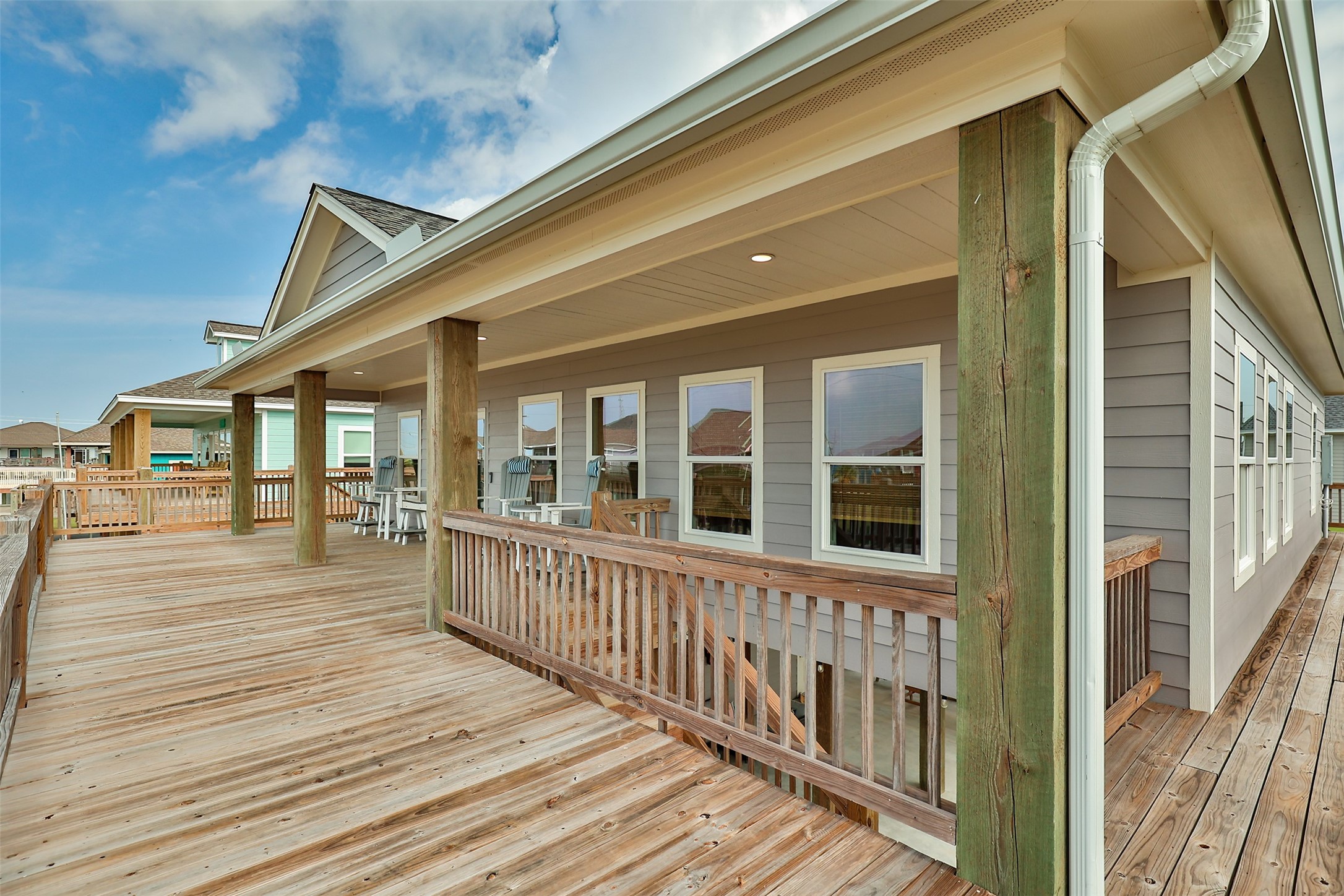 976 Albatros Crystal Beach, TX 77650 - Photo 4 of 30 a view of a house with wooden deck