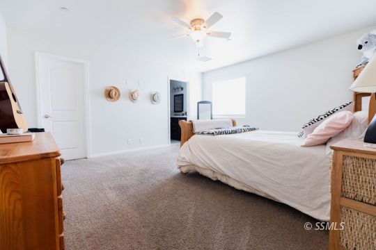 916 South Farragut Street Ridgecrest, CA 93555 - Photo 16 of 30 a bedroom with bed and window