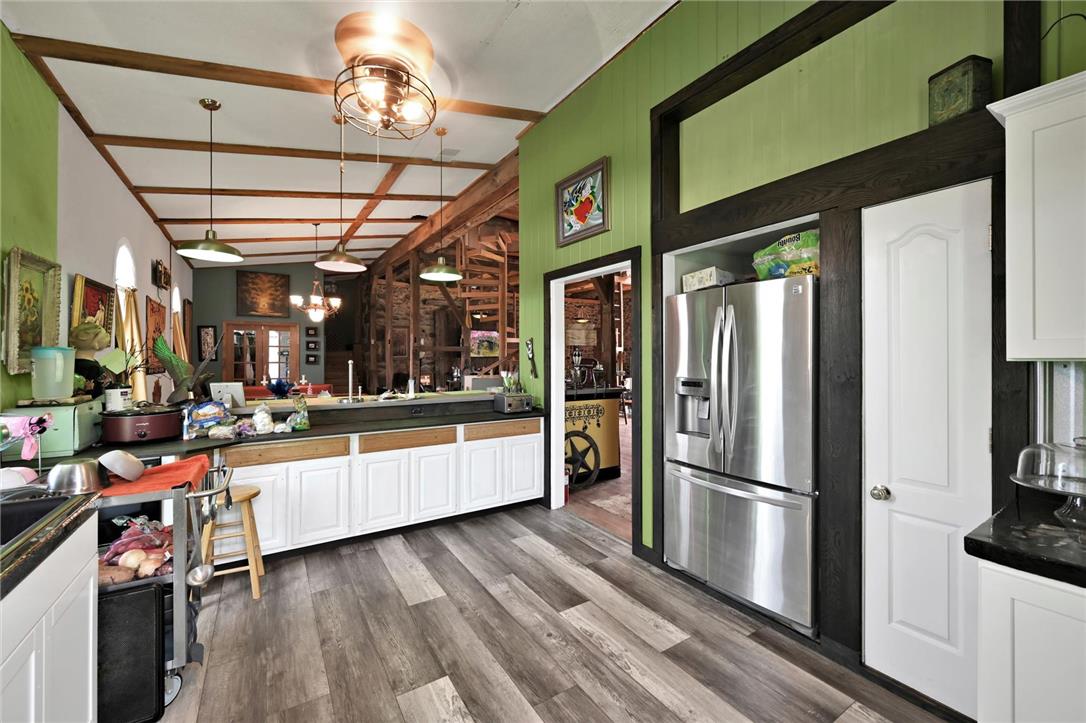 101 Conrad Road Fleetwood, PA 19522 - Photo 10 of 42 A well-equipped culinary space offers durable flooring and stainless steel appliances.