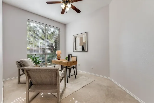 a work room with furniture and windows
