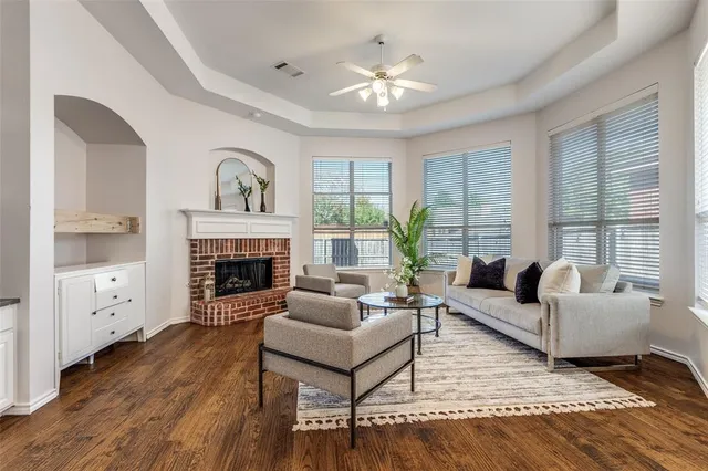 a living room with furniture fireplace and window