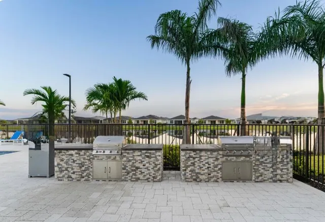 a view of outdoor kitchen with a garden