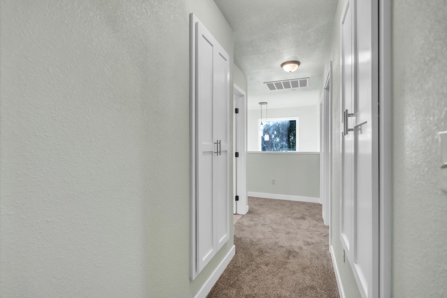 740 Hideaway Loop Alta, CA 95701 - Photo 25 of 74 a view of a hallway with wooden floor