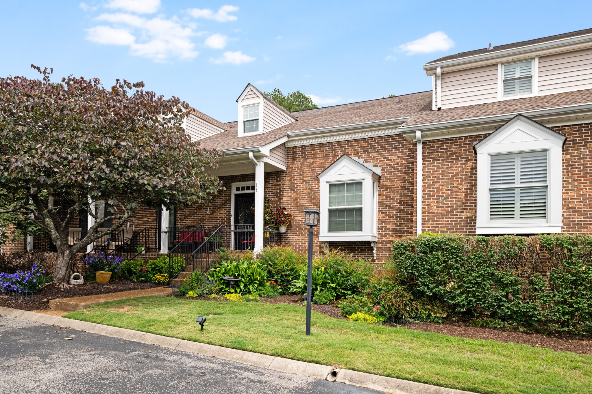 703 Foxborough Square West Brentwood, TN 37027 - Photo 1 of 32 a front view of a house with a yard