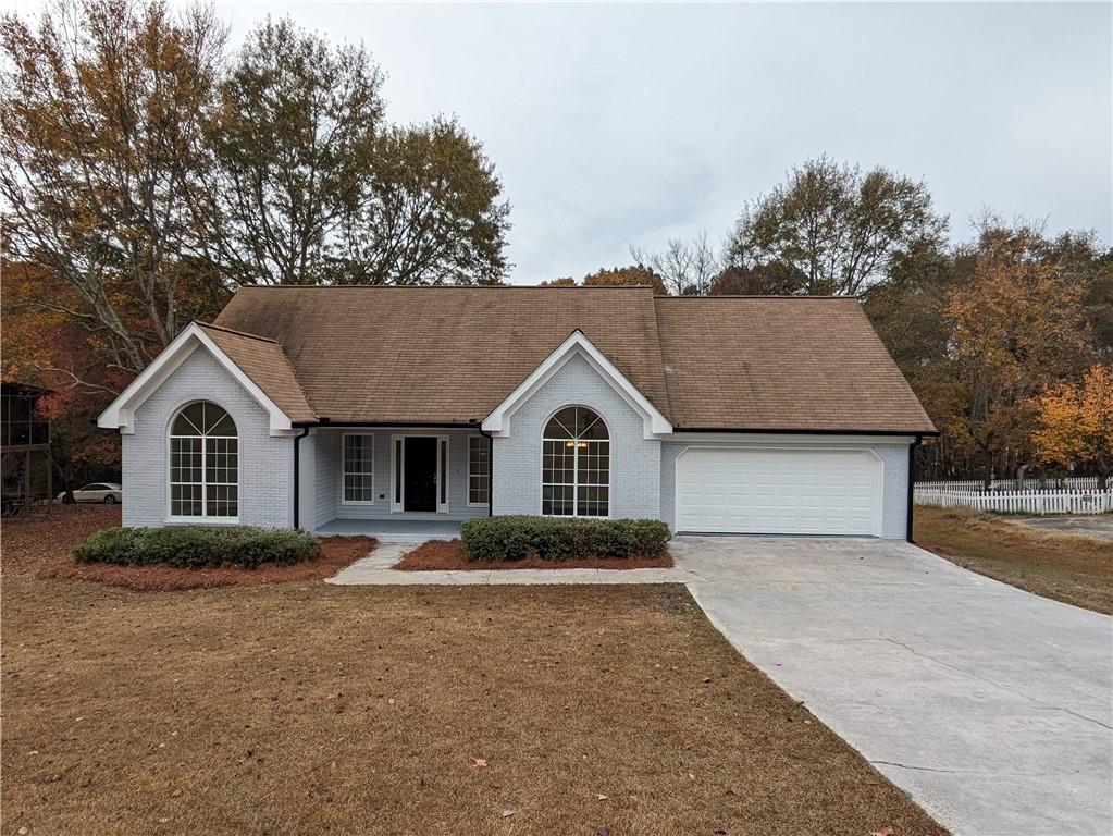 750 Ridgeland Road Bethlehem, GA 30620 - Photo 1 of 1 a front view of a house with a yard and garage