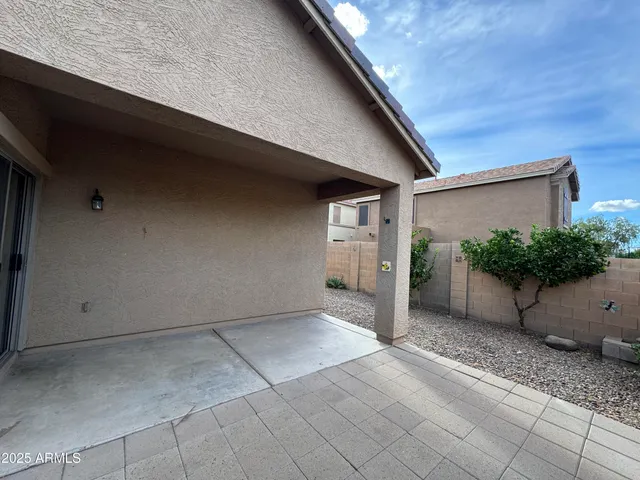 a view of a swimming pool with a yard