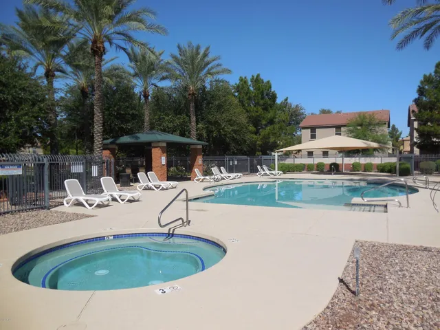 a view of a table and chairs under an umbrella