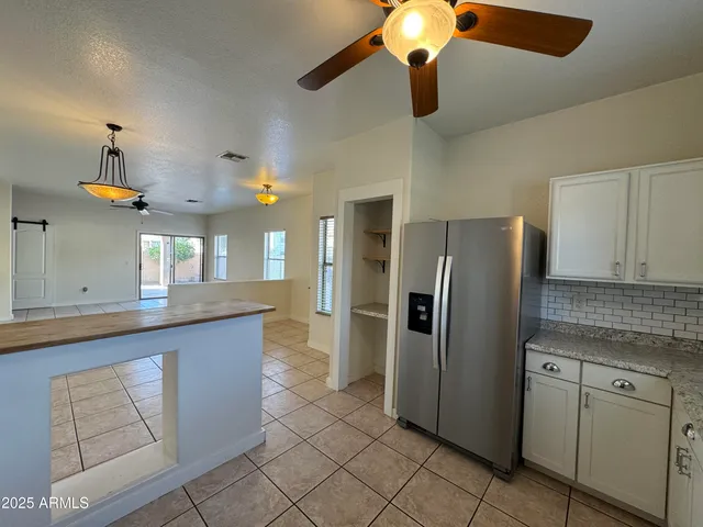 a kitchen with stainless steel appliances a sink stove and microwave