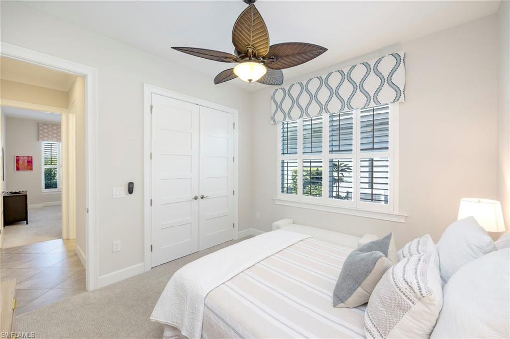 6466 Warwick Avenue Naples, FL 34113 - Photo 14 of 43 a bedroom with a bed and a window