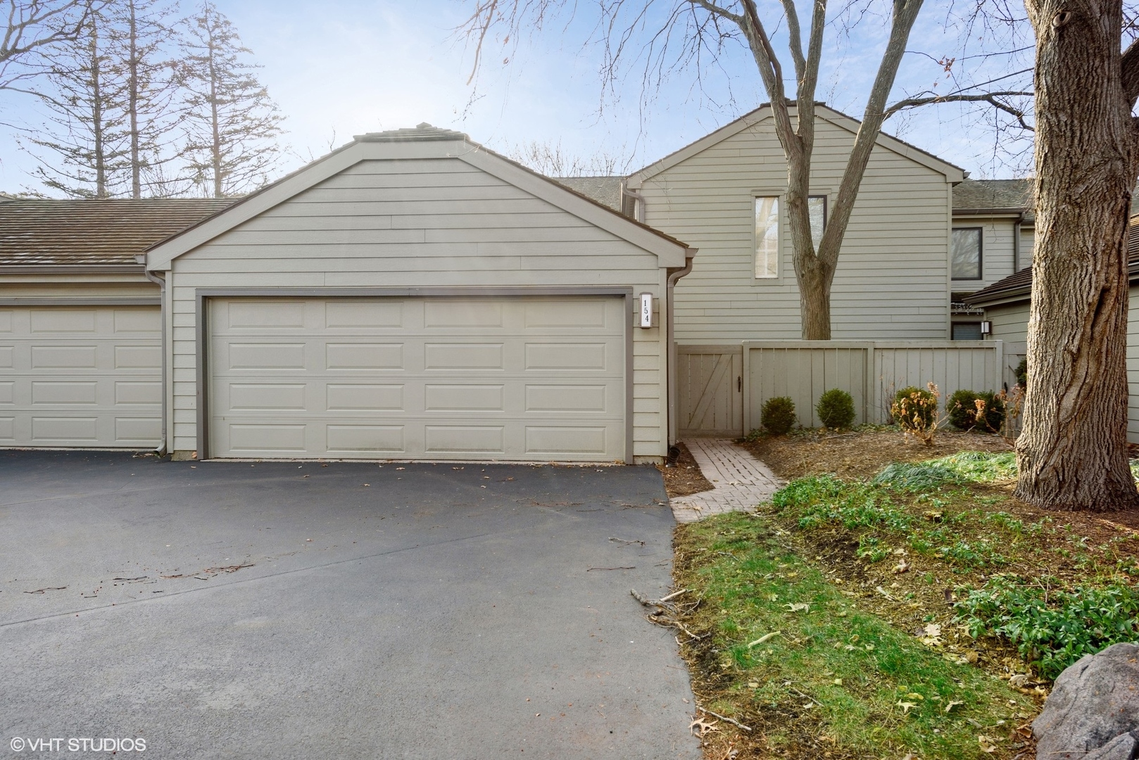 154 Timber Ridge Lane Lake Barrington, IL 60010 - Photo 1 of 26 a front view of a house with a garage
