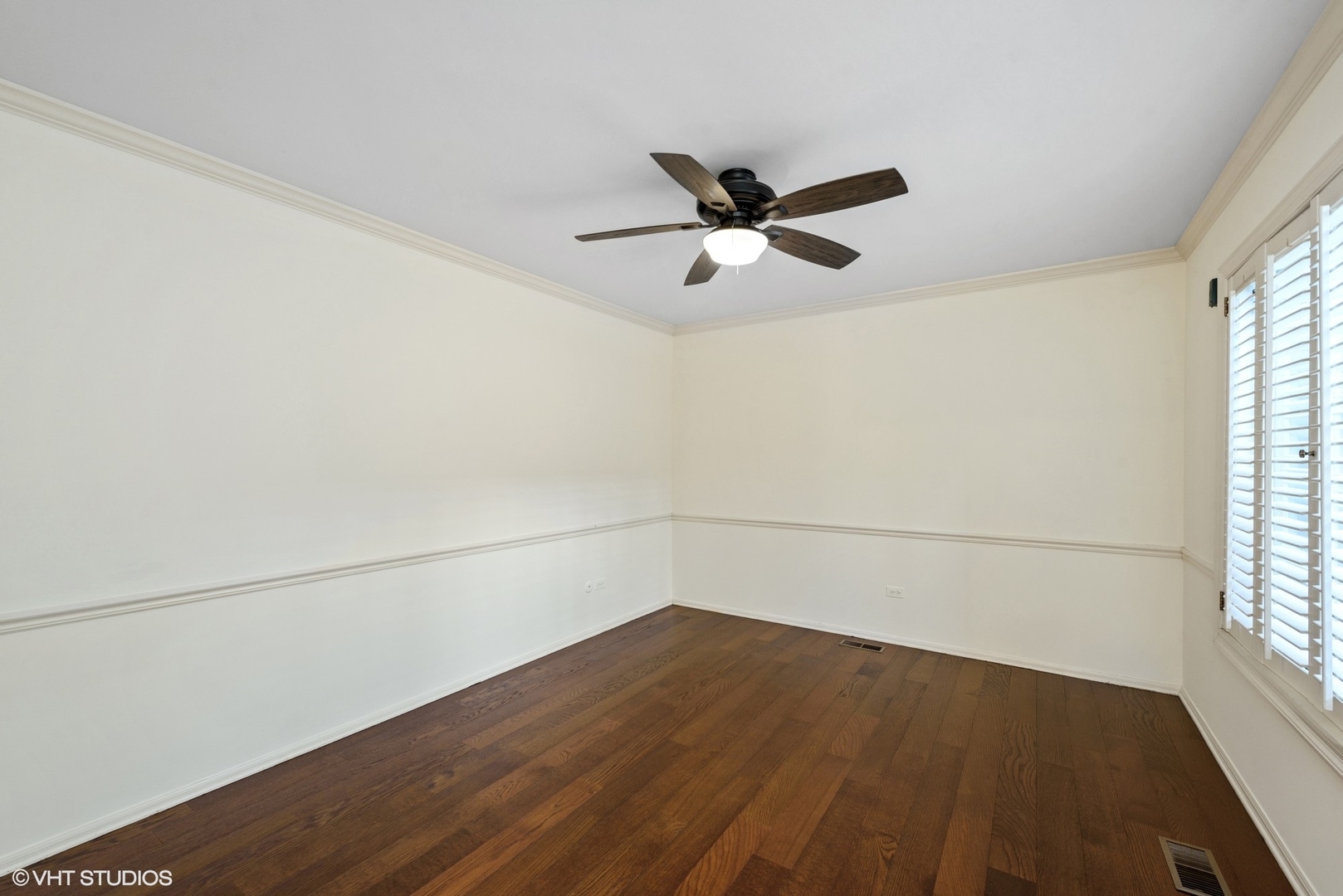 154 Timber Ridge Lane Lake Barrington, IL 60010 - Photo 11 of 26 an empty room with wooden floor and windows