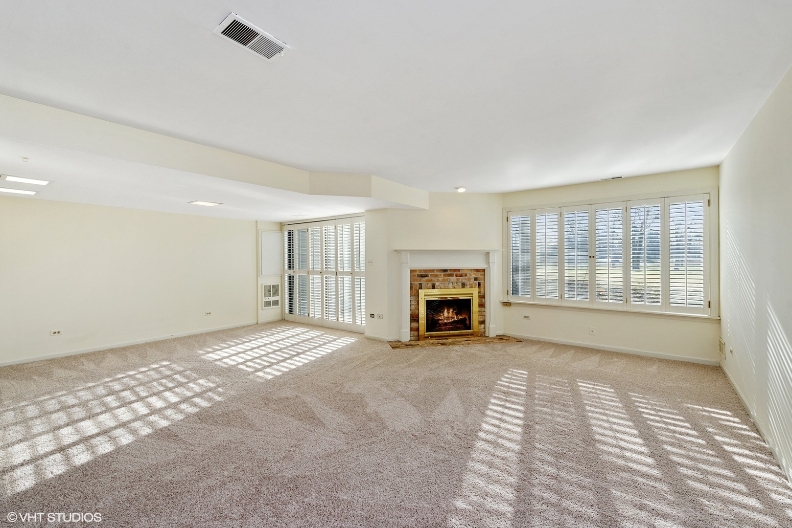 154 Timber Ridge Lane Lake Barrington, IL 60010 - Photo 20 of 26 a view of an empty room with a fireplace and a window