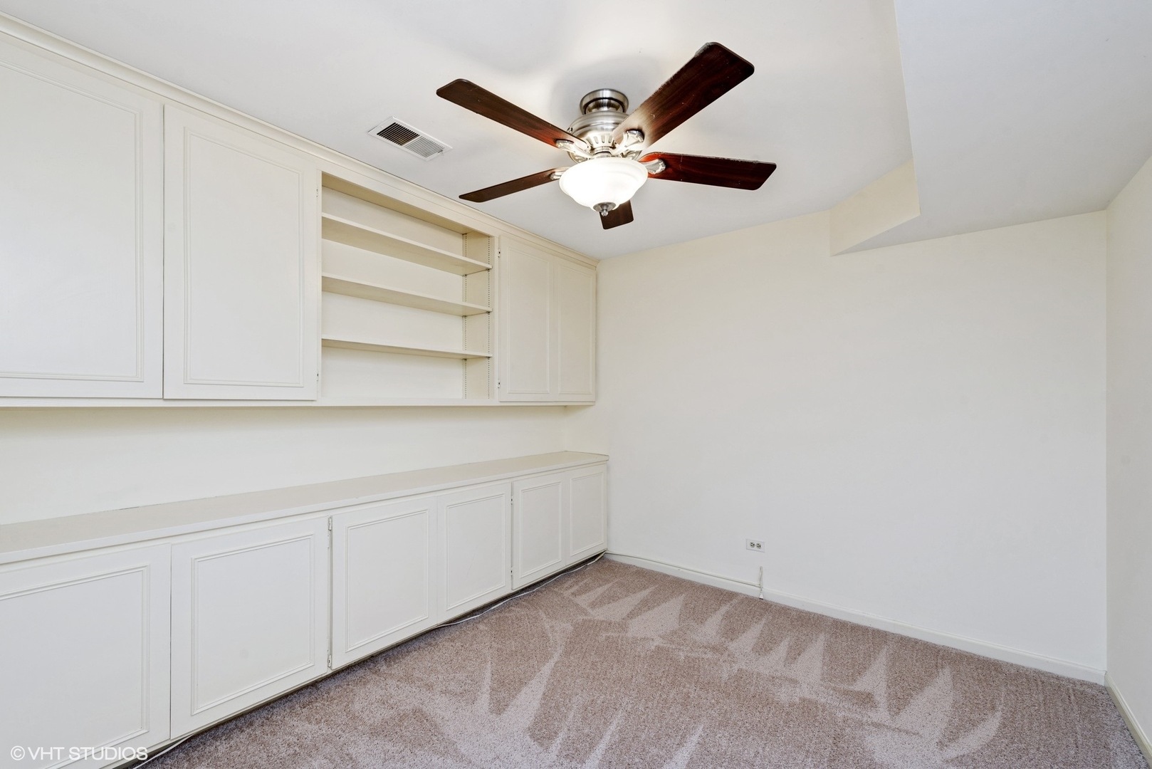 154 Timber Ridge Lane Lake Barrington, IL 60010 - Photo 23 of 26 an empty room with windows and fan