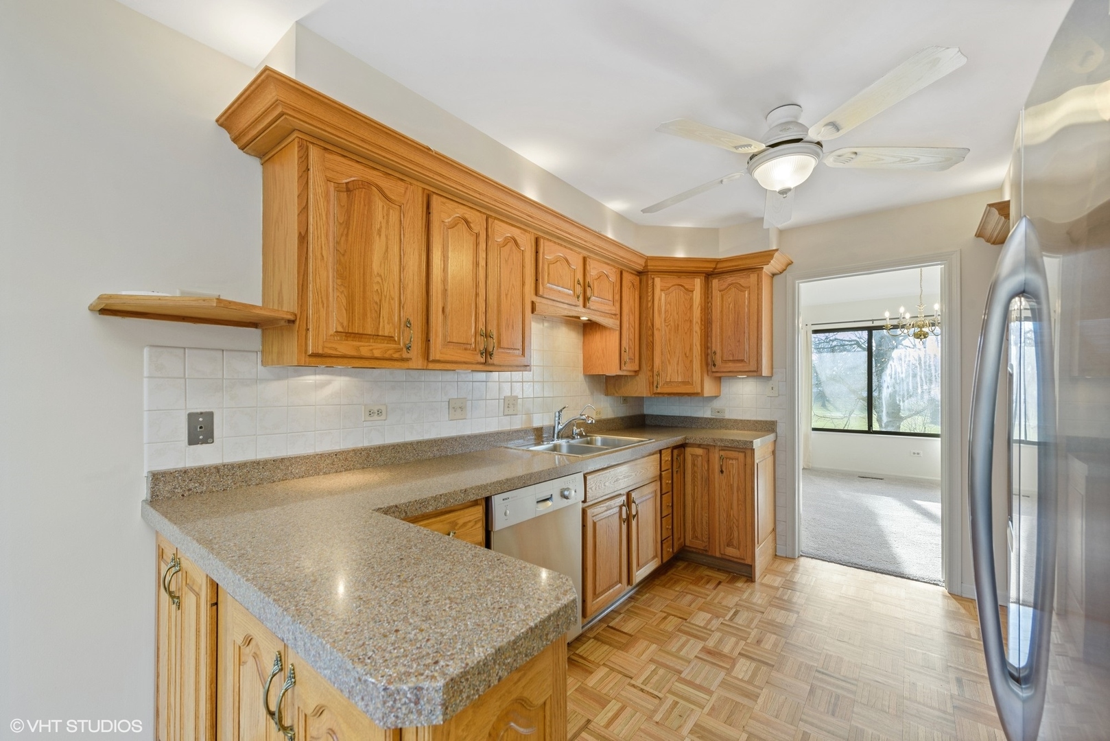 154 Timber Ridge Lane Lake Barrington, IL 60010 - Photo 5 of 26 a kitchen with a sink a stove and cabinets
