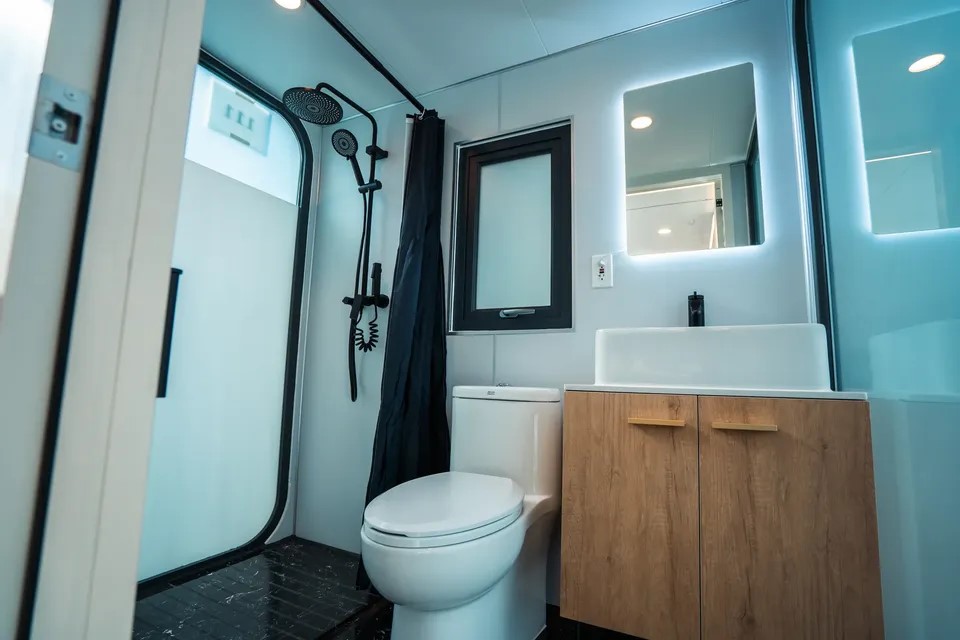 2717 Davis Street Houston, TX 77026 - Photo 12 of 17 a bathroom with a toilet and a mirror