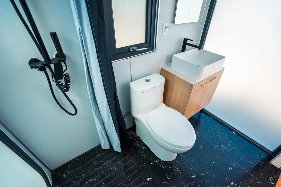 2717 Davis Street Houston, TX 77026 - Photo 15 of 17 a bathroom with a toilet and a shower