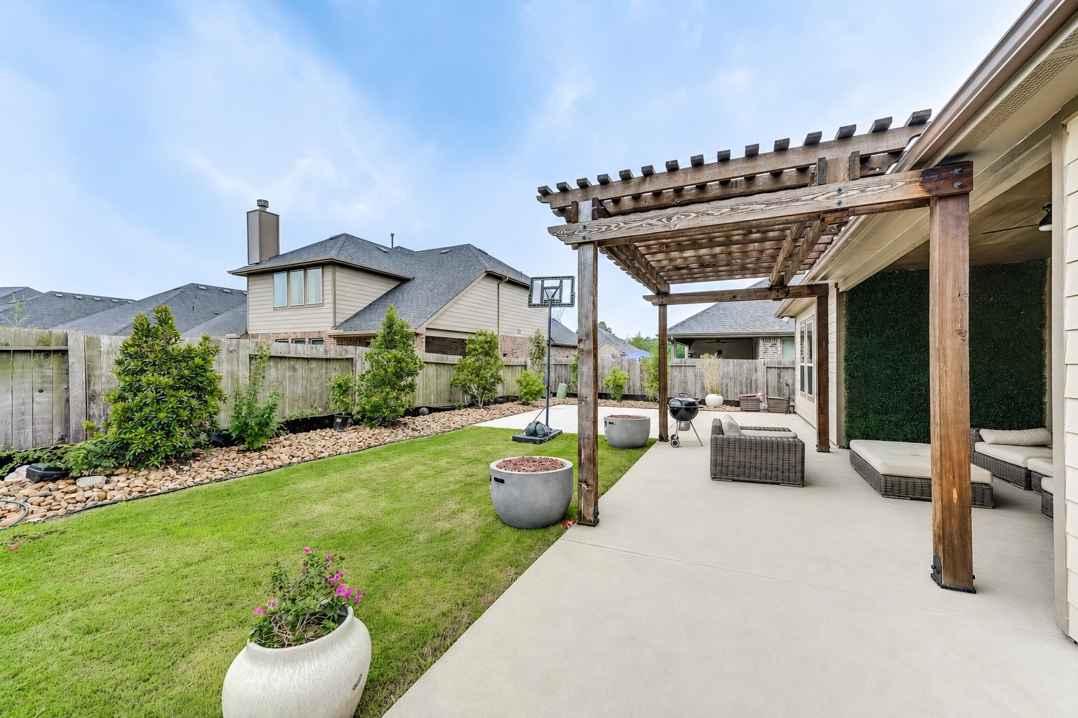 5806 Metaphor Way Rosenberg, TX 77469 - Photo 45 of 50 a view of a patio with couches table and chairs and potted plants