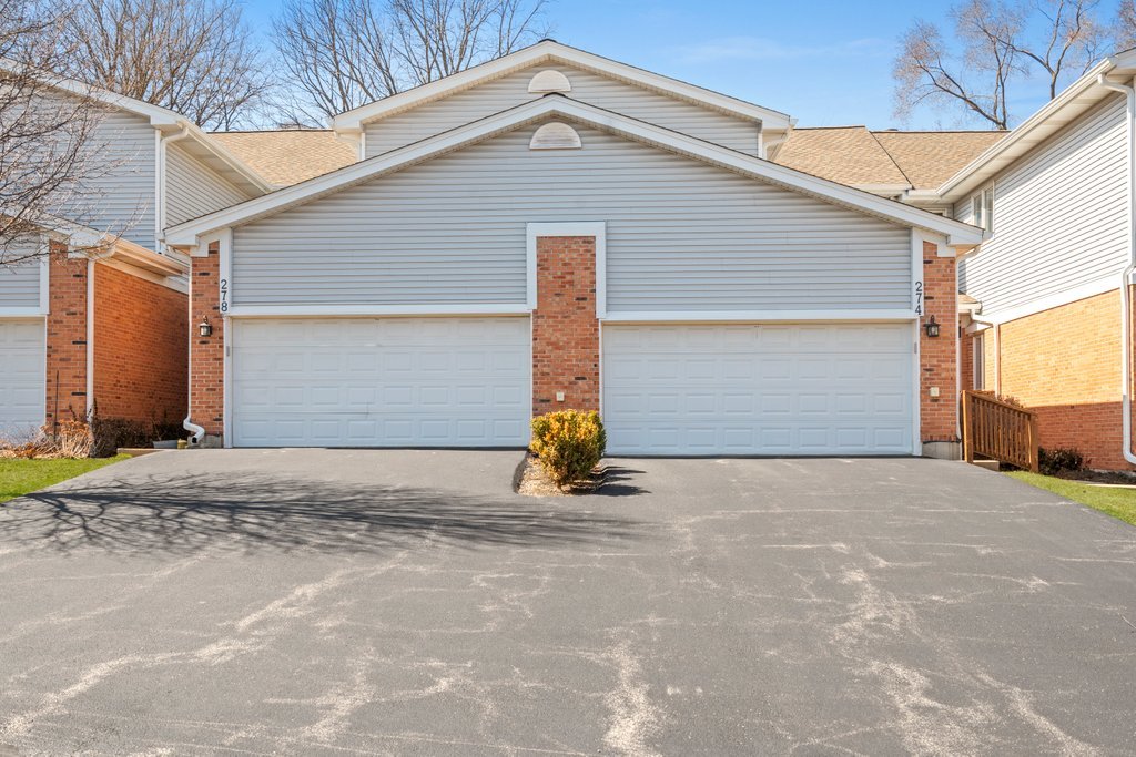 278 Charlotte Court Cary, IL 60013 - Photo 1 of 20 a view of the house with parking space