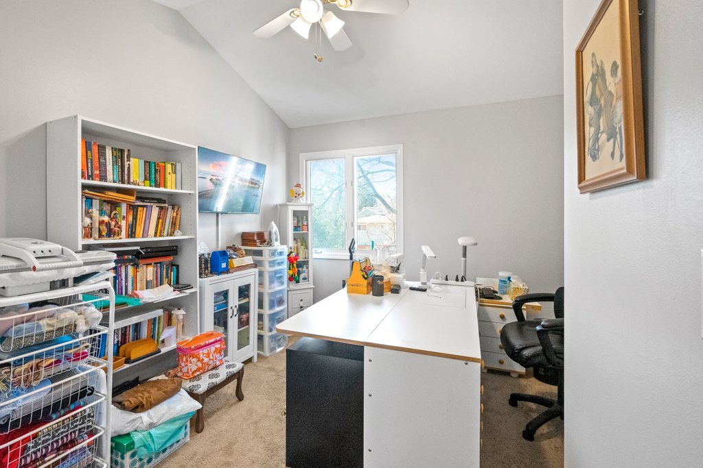 278 Charlotte Court Cary, IL 60013 - Photo 13 of 20 a workspace with furniture and a book shelf