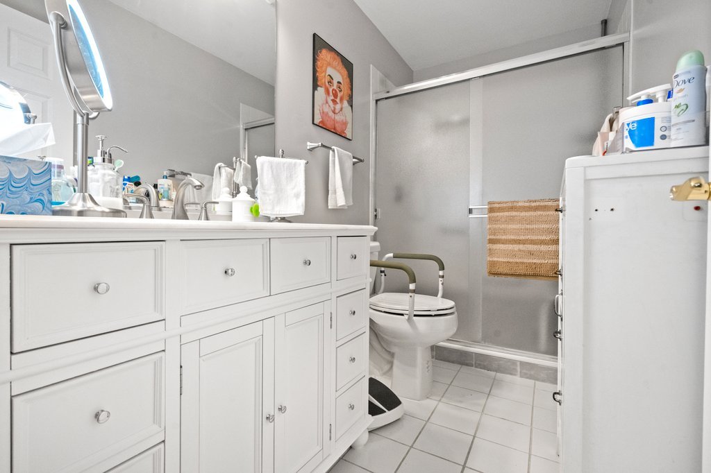 278 Charlotte Court Cary, IL 60013 - Photo 16 of 20 a bathroom with a sink a toilet and shower