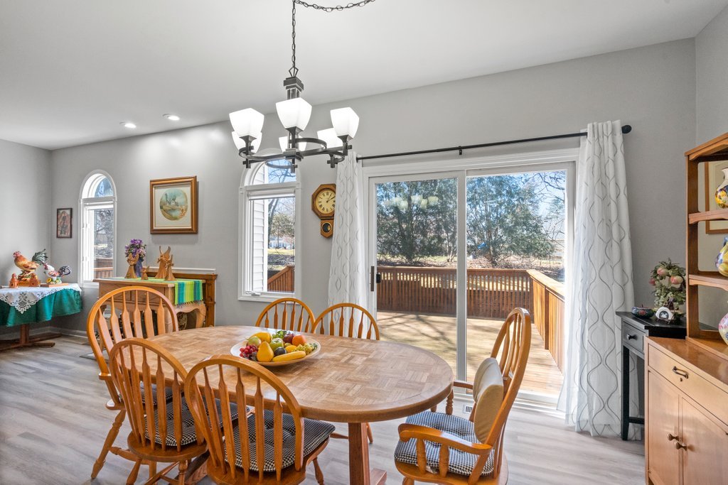 278 Charlotte Court Cary, IL 60013 - Photo 6 of 20 a view of a dining room with furniture window and wooden floor