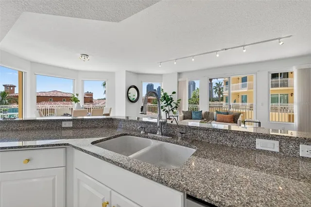 a kitchen with cabinets and stainless steel appliances