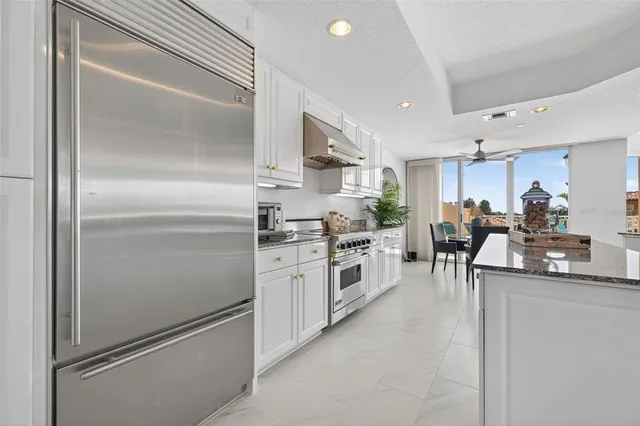 a living room with furniture a flat screen tv and a rug