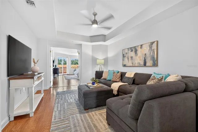 a bathroom with a bathtub a sink and a large mirror