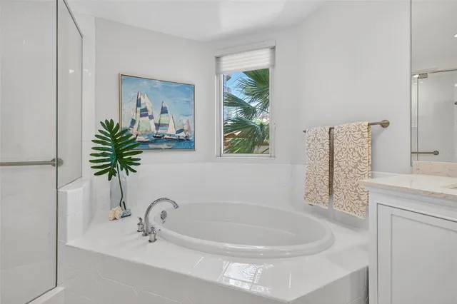 a bathroom with a sink mirror vanity and toilet