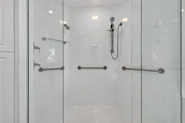 a bathroom with a bathtub and shower