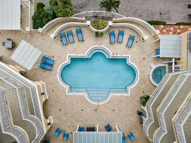 a large kitchen with a table and chairs