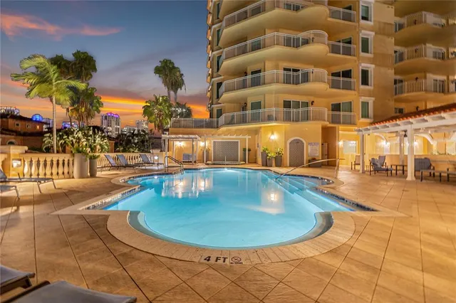 a view of a swimming pool with a patio