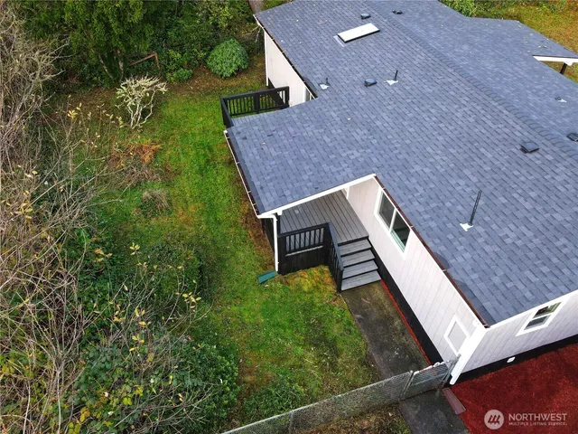 a roof deck view with wooden floor and fence