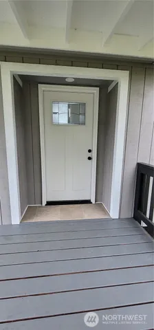 a view of a porch with wooden floor and outdoor space